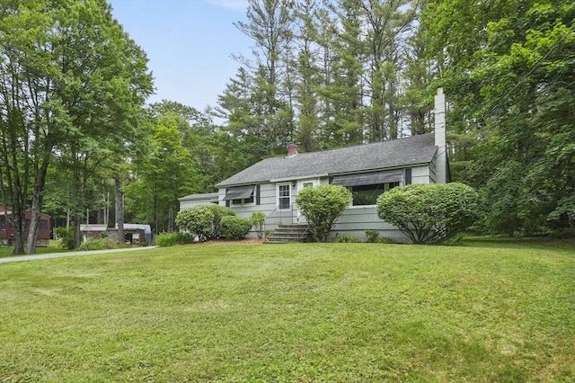 49 Winchendon Rd, Templeton, MA 01436 - view of front of home featuring a front lawn, a chimney, entry steps, and a shingled roof