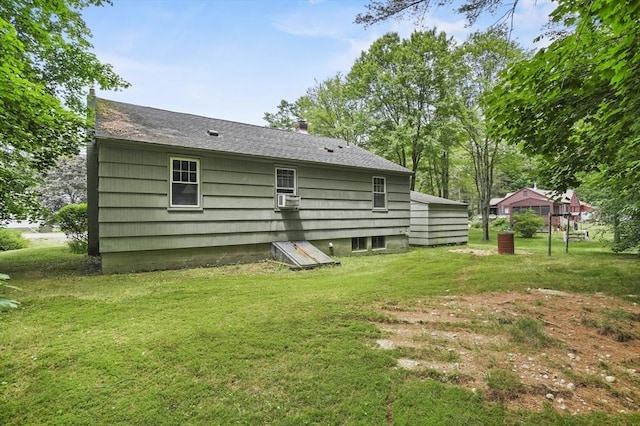 49 Winchendon Rd, Templeton, MA 01436 - back of house with a lawn, cooling unit, a chimney, and roof with shingles