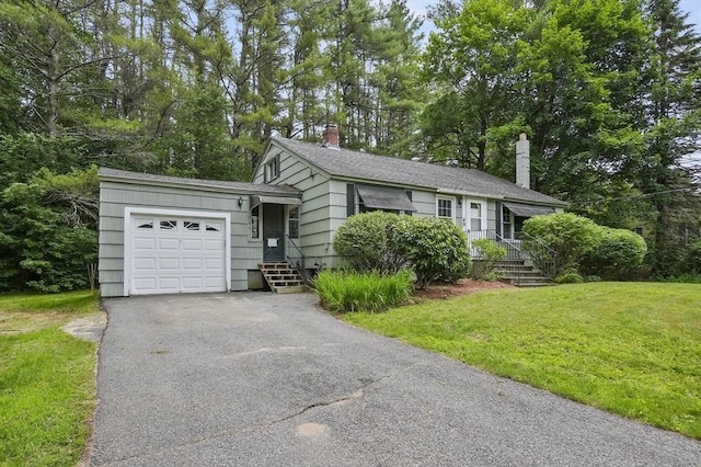 49 Winchendon Rd, Templeton, MA 01436 - view of front of home with a front yard, a garage, driveway, a chimney, and view of scattered trees