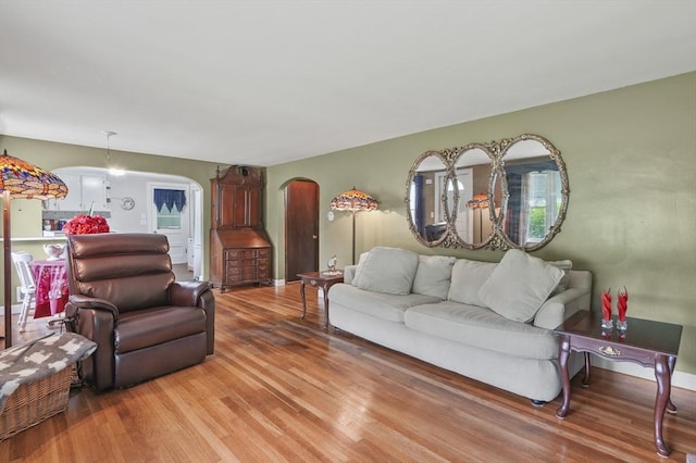 49 Winchendon Rd, Templeton, MA 01436 - living area featuring arched walkways and light wood-style flooring