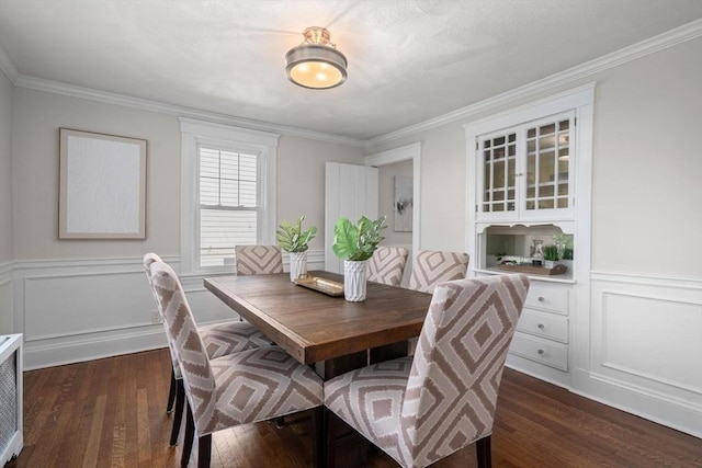 52 Myrtle St, Newton, MA 02465 - dining room with dark wood finished floors, crown molding, a wainscoted wall, and a decorative wall