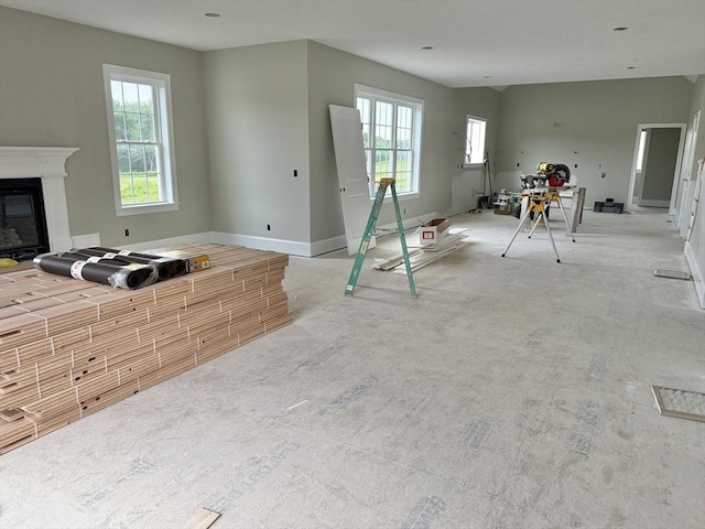 87 Magill Dr, Grafton, MA 01519 - living room with healthy amount of natural light and a glass covered fireplace