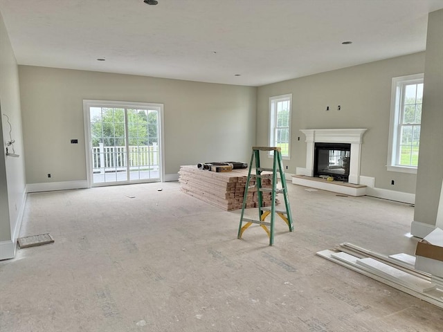 87 Magill Dr, Grafton, MA 01519 - living room featuring a glass covered fireplace and carpet