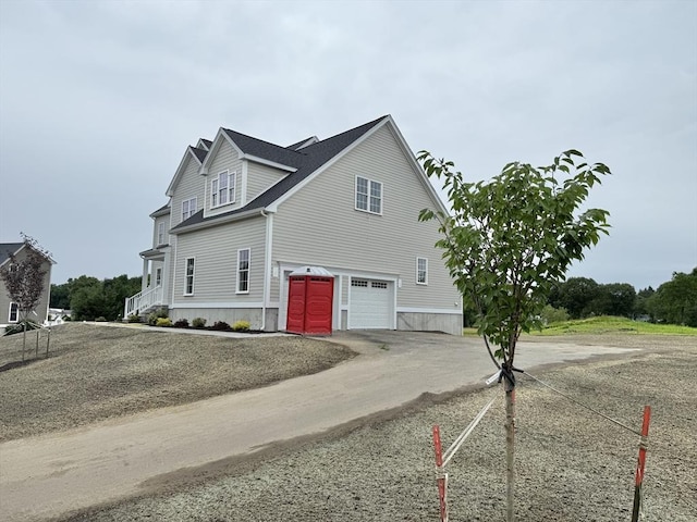 87 Magill Dr, Grafton, MA 01519 - view of side of home featuring dirt driveway and a garage