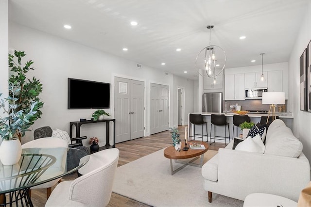 living room with light hardwood / wood-style floors