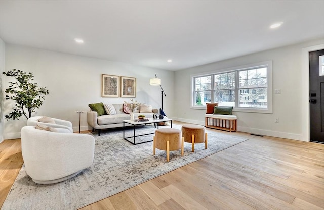 living room with light hardwood / wood-style floors