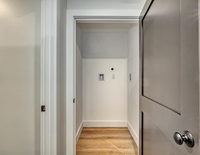 washroom with hookup for a washing machine, electric dryer hookup, and light wood-type flooring