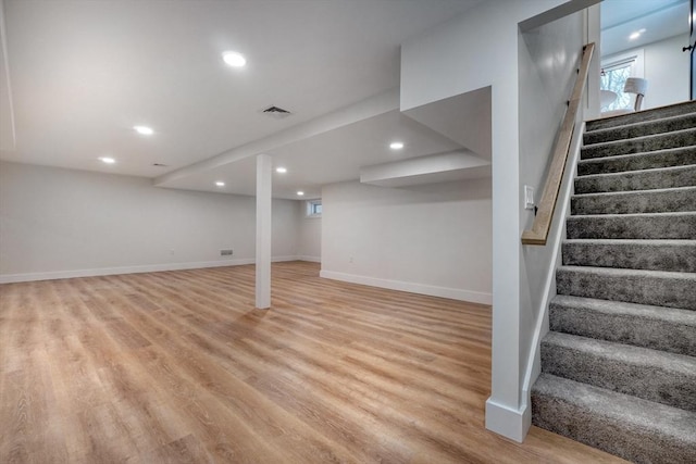 basement featuring light wood-type flooring