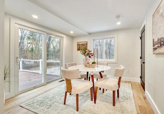 dining area with light hardwood / wood-style flooring