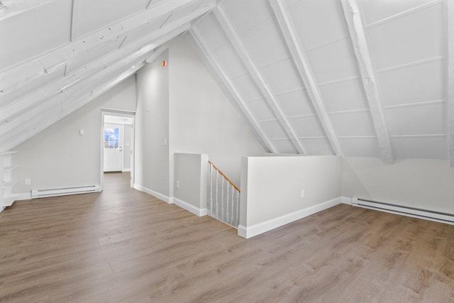 bonus room featuring a baseboard radiator, vaulted ceiling, and light wood-style flooring