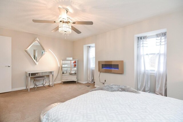 bedroom with light carpet and ceiling fan