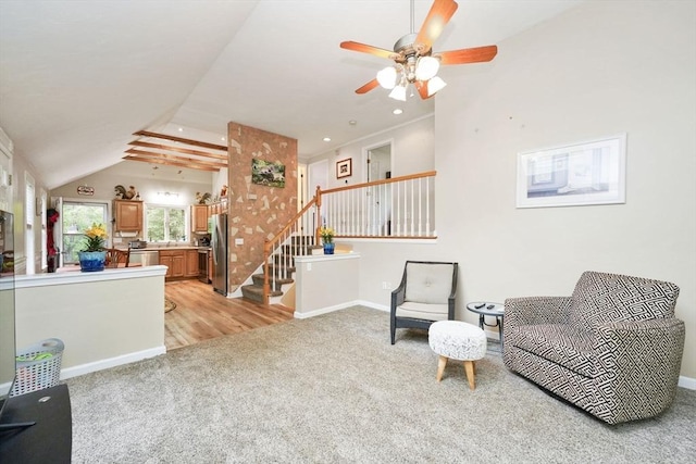 1 Fellowship Cir, Wareham, MA 02576 - sitting room with light colored carpet, stairs, a ceiling fan, vaulted ceiling, and baseboards
