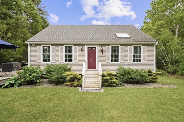 1 Fellowship Cir, Wareham, MA 02576 - view of front of property featuring a front yard and a shingled roof
