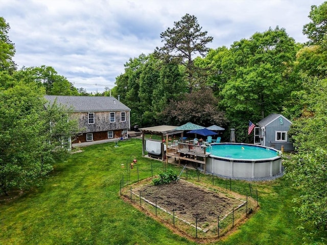 1 Fellowship Cir, Wareham, MA 02576 - view of green lawn featuring an outdoor pool and a garden