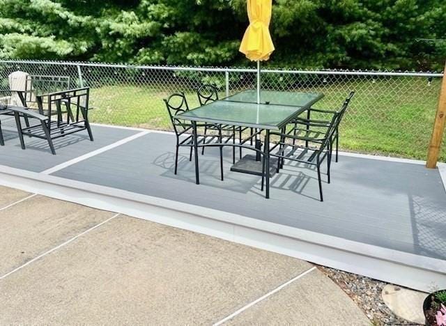 view of patio / terrace featuring outdoor dining space and fence