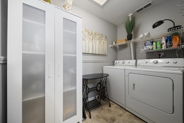 34 Newhall St Unit 313, Lowell, MA 01852 - clothes washing area featuring washing machine and dryer and a textured ceiling
