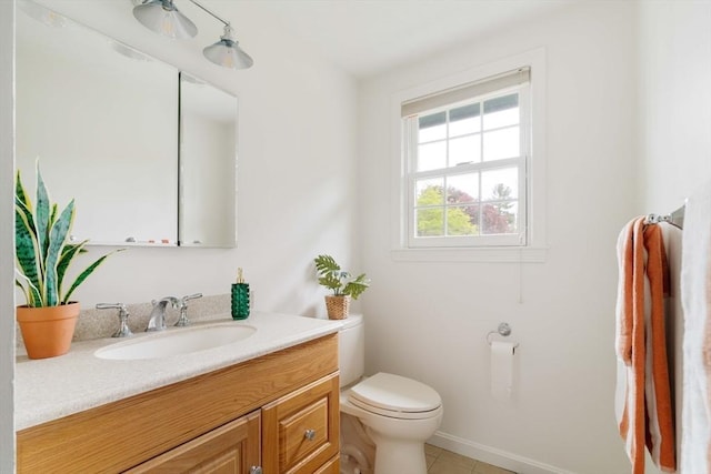 50 Hillside Rd, Tewksbury, MA 01876 - half bath with vanity, toilet, tile patterned flooring, and baseboards