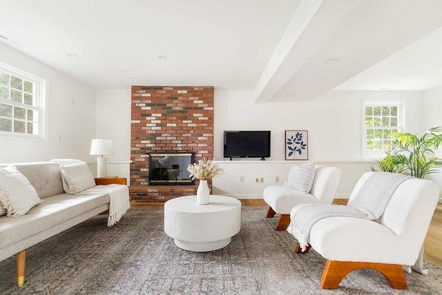 50 Hillside Rd, Tewksbury, MA 01876 - living room with wood finished floors, a fireplace, and baseboards