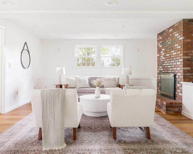 50 Hillside Rd, Tewksbury, MA 01876 - living area with wood finished floors, a fireplace, and baseboards