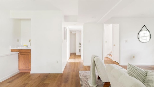 50 Hillside Rd, Tewksbury, MA 01876 - living room featuring wet bar, light wood-type flooring, and baseboards