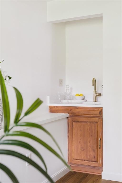 50 Hillside Rd, Tewksbury, MA 01876 - bathroom featuring wood finished floors, baseboards, and vanity
