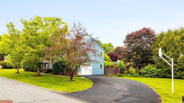 50 Hillside Rd, Tewksbury, MA 01876 - view of property hidden behind natural elements with asphalt driveway and an attached garage