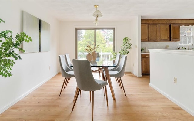 50 Hillside Rd, Tewksbury, MA 01876 - dining area with plenty of natural light, light wood-type flooring, and baseboards