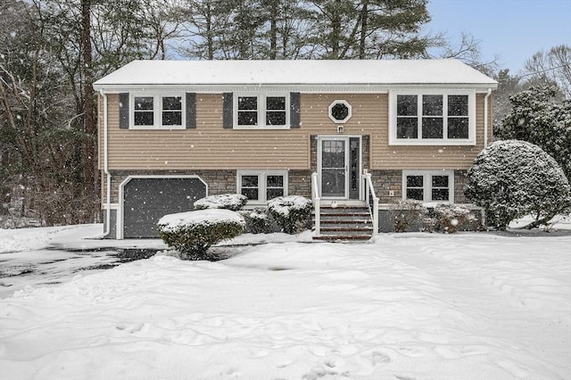 bi-level home featuring a garage