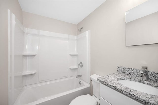 full bathroom featuring vanity, bathing tub / shower combination, and toilet