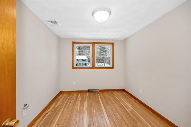 unfurnished room featuring light hardwood / wood-style flooring