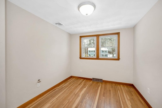 unfurnished room featuring hardwood / wood-style floors