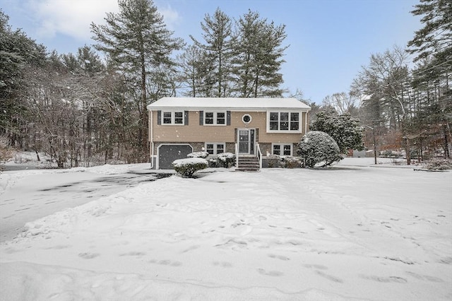 split foyer home featuring a garage