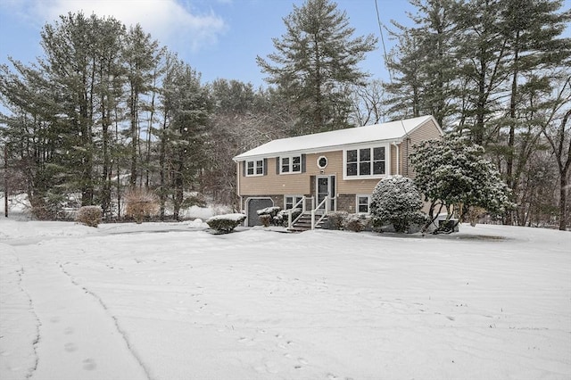 split foyer home featuring a garage