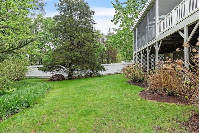 view of yard featuring a sunroom