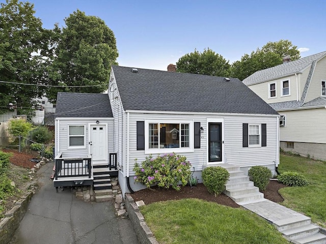 45 Weyham Rd, Weymouth, MA 02191 - view of front of property featuring a chimney and a shingled roof