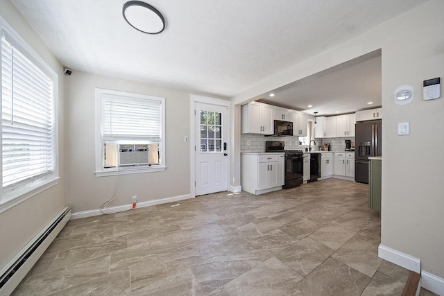 45 Weyham Rd, Weymouth, MA 02191 - kitchen with black appliances, baseboard heating, cooling unit, a sink, and white cabinetry