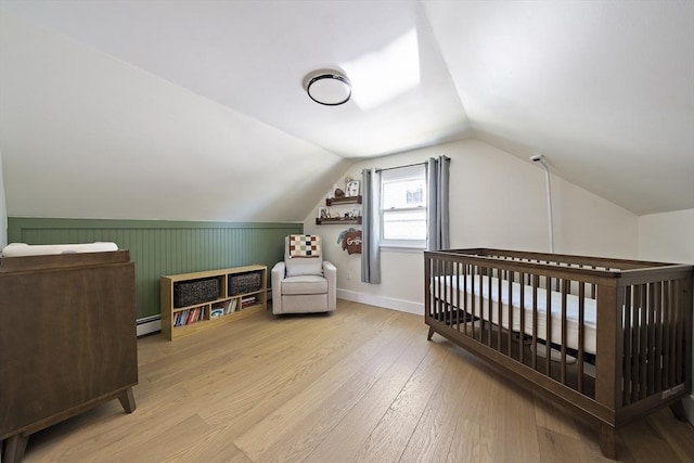 45 Weyham Rd, Weymouth, MA 02191 - bedroom with baseboard heating, wood finished floors, lofted ceiling, a nursery area, and baseboards