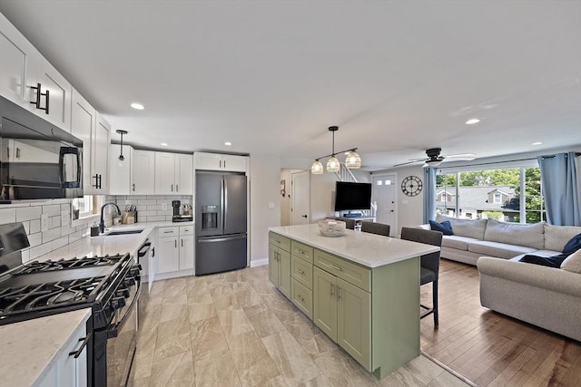 45 Weyham Rd, Weymouth, MA 02191 - kitchen featuring black appliances, green cabinets, a sink, open floor plan, and recessed lighting