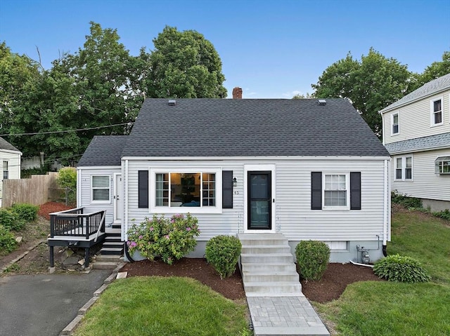 45 Weyham Rd, Weymouth, MA 02191 - view of front of home featuring a chimney, a deck, and roof with shingles