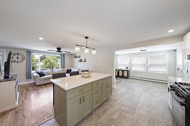 45 Weyham Rd, Weymouth, MA 02191 - kitchen with black range with gas cooktop, baseboard heating, pendant lighting, open floor plan, and recessed lighting
