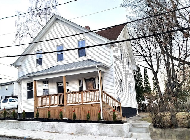 view of front of property featuring covered porch