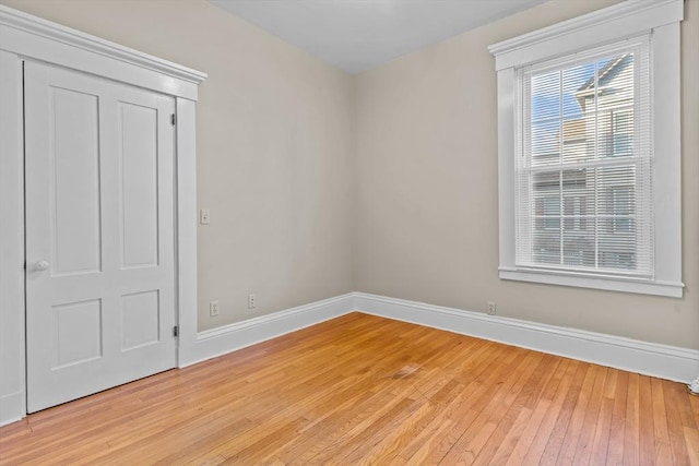 spare room featuring light hardwood / wood-style flooring