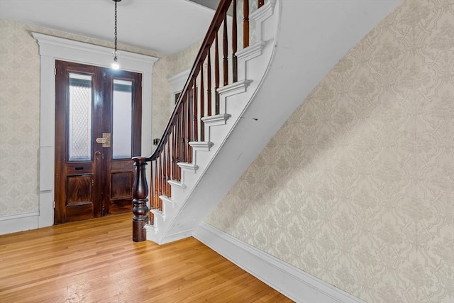 foyer entrance featuring hardwood / wood-style floors