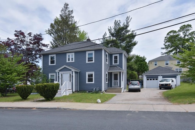 colonial inspired home featuring an outbuilding and a detached garage