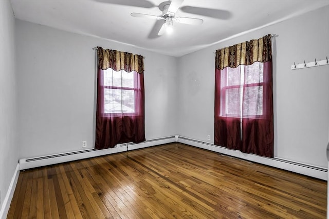 unfurnished room with wood-type flooring, healthy amount of natural light, and ceiling fan