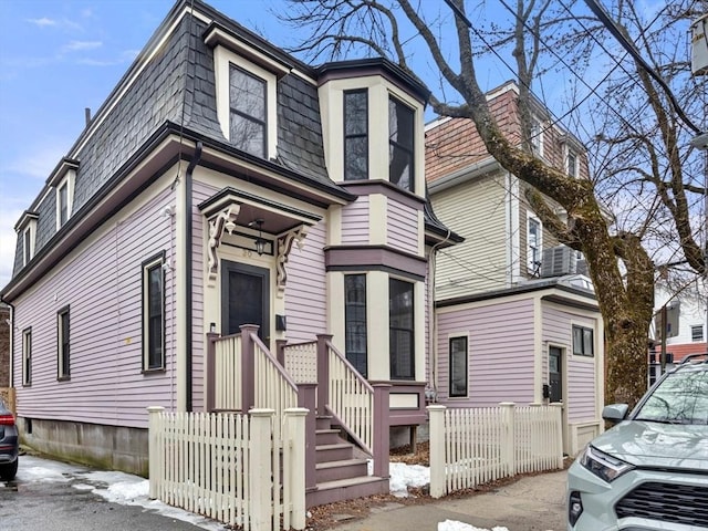 30 Howard St, Cambridge, MA 02139 - victorian home featuring mansard roof and fence
