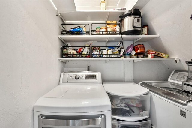30 Howard St, Cambridge, MA 02139 - washroom with washer and clothes dryer and a textured wall