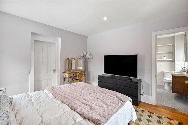 30 Howard St, Cambridge, MA 02139 - bedroom with light wood-type flooring, a sink, recessed lighting, baseboards, and ensuite bathroom