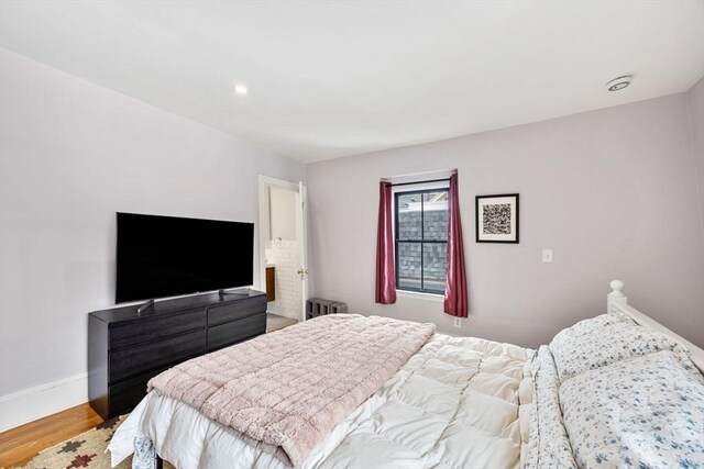 30 Howard St, Cambridge, MA 02139 - bedroom featuring radiator, wood finished floors, baseboards, and recessed lighting