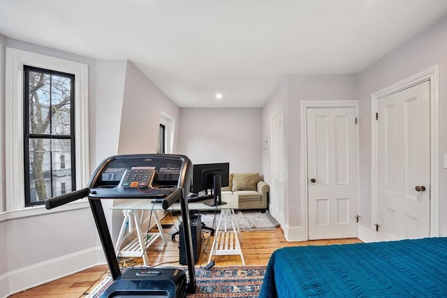 30 Howard St, Cambridge, MA 02139 - bedroom with an office area, wood finished floors, baseboards, and recessed lighting